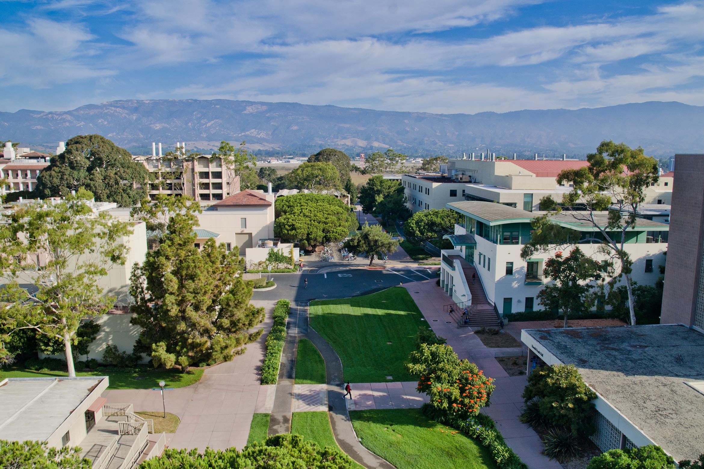 View from a building on the UC Santa Barbara campus encompassing walkways, other buildings and the mountains in the distance